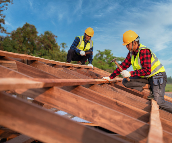 professionals building a roof
